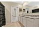 Clean bathroom with granite countertops and double sinks at 11237 Amber Ridge Dr, Zellwood, FL 32798