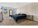 Spacious Primary bedroom with large bed and plenty of natural light at 11237 Amber Ridge Dr, Zellwood, FL 32798
