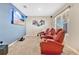 Home theater room with a large screen TV and red leather seating at 11237 Amber Ridge Dr, Zellwood, FL 32798