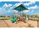 Community playground with shaded play structure and play area at 11237 Amber Ridge Dr, Zellwood, FL 32798
