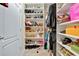 Well-organized walk-in closet with custom shelving at 11237 Amber Ridge Dr, Zellwood, FL 32798
