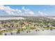 Aerial view of a luxury home community by the lake, showcasing waterfront properties at 1610 Conway Isle Cir, Belle Isle, FL 32809