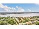 Aerial view of property, highlighting its waterfront location and city skyline views at 1610 Conway Isle Cir, Belle Isle, FL 32809