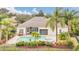 Home features a private pool, expansive patio, and lush landscaping at 1610 Conway Isle Cir, Belle Isle, FL 32809