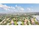 Aerial view of a home near a lake in a residential area at 1610 Conway Isle Cir, Belle Isle, FL 32809