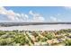 Aerial view showcasing the property's waterfront location and surrounding landscape at 1610 Conway Isle Cir, Belle Isle, FL 32809