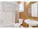 Clean bathroom with a shower/tub combo and updated vanity at 1610 Conway Isle Cir, Belle Isle, FL 32809