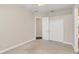 Bright bedroom with double door closet and ceiling fan at 1610 Conway Isle Cir, Belle Isle, FL 32809