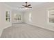 Spacious bedroom with carpet flooring and large windows at 1610 Conway Isle Cir, Belle Isle, FL 32809