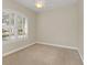 Spacious bedroom with large window and neutral decor at 1610 Conway Isle Cir, Belle Isle, FL 32809
