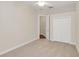 Spacious bedroom with carpet flooring and double door closet at 1610 Conway Isle Cir, Belle Isle, FL 32809