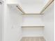 Walk-in closet with wooden shelves and hanging rods at 1610 Conway Isle Cir, Belle Isle, FL 32809