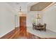 Spacious dining area with hardwood floors and an elegant chandelier at 1610 Conway Isle Cir, Belle Isle, FL 32809