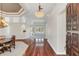 Bright and spacious entryway with hardwood floors, leading to living and dining areas at 1610 Conway Isle Cir, Belle Isle, FL 32809