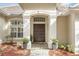 Elegant entryway with double doors and tile flooring at 1610 Conway Isle Cir, Belle Isle, FL 32809