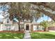 Beautiful home with mature landscaping and a large oak tree at 1610 Conway Isle Cir, Belle Isle, FL 32809