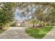 Home with circular driveway and lush landscaping at 1610 Conway Isle Cir, Belle Isle, FL 32809