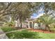 House with a nicely landscaped yard at 1610 Conway Isle Cir, Belle Isle, FL 32809