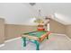 Game room with pool table and wet bar at 1610 Conway Isle Cir, Belle Isle, FL 32809