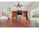 Gathering room boasts hardwood floors, a fireplace, and built-in shelving at 1610 Conway Isle Cir, Belle Isle, FL 32809