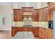 Bright kitchen with granite counters and custom cabinetry at 1610 Conway Isle Cir, Belle Isle, FL 32809