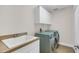 Laundry room with washer, dryer, and utility sink at 1610 Conway Isle Cir, Belle Isle, FL 32809