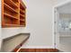 Built-in wooden shelves and a desk in a home office at 1610 Conway Isle Cir, Belle Isle, FL 32809