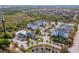 Aerial view of apartment community with pool and surrounding landscape at 3175 Feltrim Pl # 305, Kissimmee, FL 34747