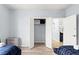 Bedroom with two twin beds and access to closet and living room at 3175 Feltrim Pl # 305, Kissimmee, FL 34747