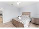 Bedroom with a queen bed, nightstands, and ceiling fan at 3175 Feltrim Pl # 305, Kissimmee, FL 34747