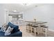 Open concept dining area with a farmhouse table and seating for six at 3175 Feltrim Pl # 305, Kissimmee, FL 34747