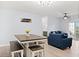 Open dining area with a table and bench seating at 3175 Feltrim Pl # 305, Kissimmee, FL 34747