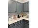 Kitchen with gray cabinets and white countertop at 3175 Feltrim Pl # 305, Kissimmee, FL 34747