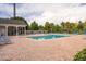 Inviting community pool with ample lounge chairs and covered seating area at 3175 Feltrim Pl # 305, Kissimmee, FL 34747