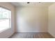 Simple bedroom with window, ceiling fan, and neutral walls at 368 Pelham Park Dr, Deland, FL 32720