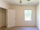 Well-lit bedroom with closet and window at 368 Pelham Park Dr, Deland, FL 32720