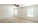 Well-lit bedroom with ceiling fan and carpet at 368 Pelham Park Dr, Deland, FL 32720