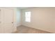 Simple bedroom with neutral walls and carpet at 368 Pelham Park Dr, Deland, FL 32720