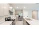 Modern kitchen with stainless steel appliances and light cabinets at 368 Pelham Park Dr, Deland, FL 32720
