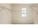Large walk-in closet with window and shelving at 368 Pelham Park Dr, Deland, FL 32720