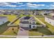 Two story house with solar panels and a large backyard at 4360 Sunset Preserve Blvd, Orlando, FL 32820