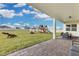 Large backyard with playground, patio, and seating area at 4360 Sunset Preserve Blvd, Orlando, FL 32820