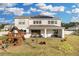 Home with solar panels and a large backyard with a playground at 4360 Sunset Preserve Blvd, Orlando, FL 32820
