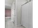 Clean bathroom with shower and white tile floors at 4360 Sunset Preserve Blvd, Orlando, FL 32820