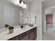 Modern bathroom with dark brown vanity and a shower at 4360 Sunset Preserve Blvd, Orlando, FL 32820