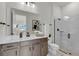 Elegant bathroom with a walk-in shower and double vanity at 4360 Sunset Preserve Blvd, Orlando, FL 32820