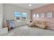Well-lit bedroom with a crib and a ' wardrobe at 4360 Sunset Preserve Blvd, Orlando, FL 32820