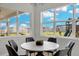 Bright breakfast nook with a round table and backyard views at 4360 Sunset Preserve Blvd, Orlando, FL 32820