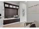 Inviting entryway with built-in bench, storage, and decorative pillows at 4360 Sunset Preserve Blvd, Orlando, FL 32820