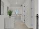 Bright hallway with a window and an ornate railing at 4360 Sunset Preserve Blvd, Orlando, FL 32820